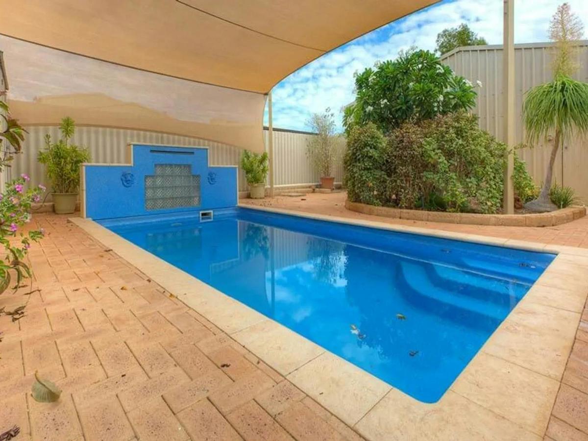 Cool off in the private swimming pool surrounded by a peaceful and enclosed outdoor space