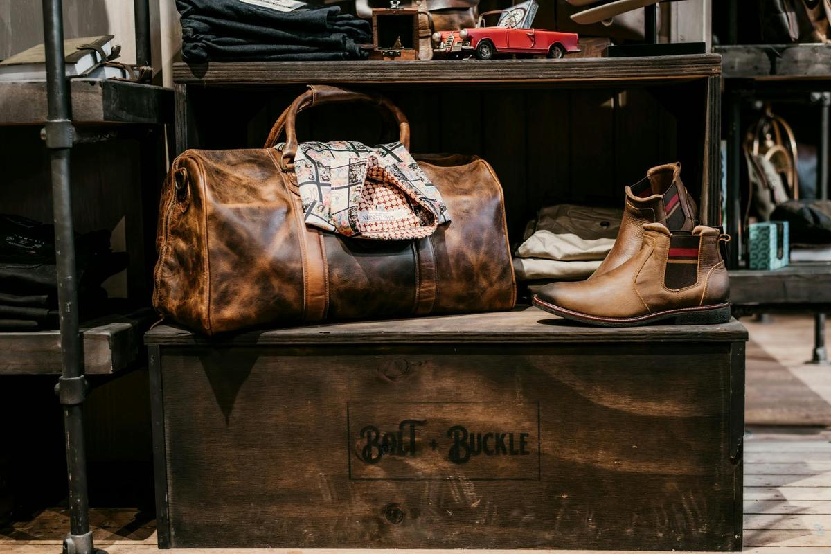 Indepal Leather duffle bag with leather Chelsea boots and a Rock and Roll Religion shirt