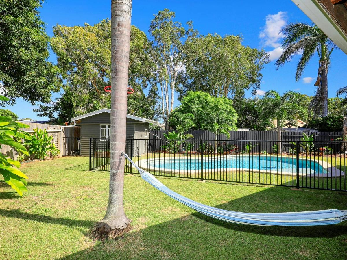 Quiet back yard with a hammock and fully fenced pool area