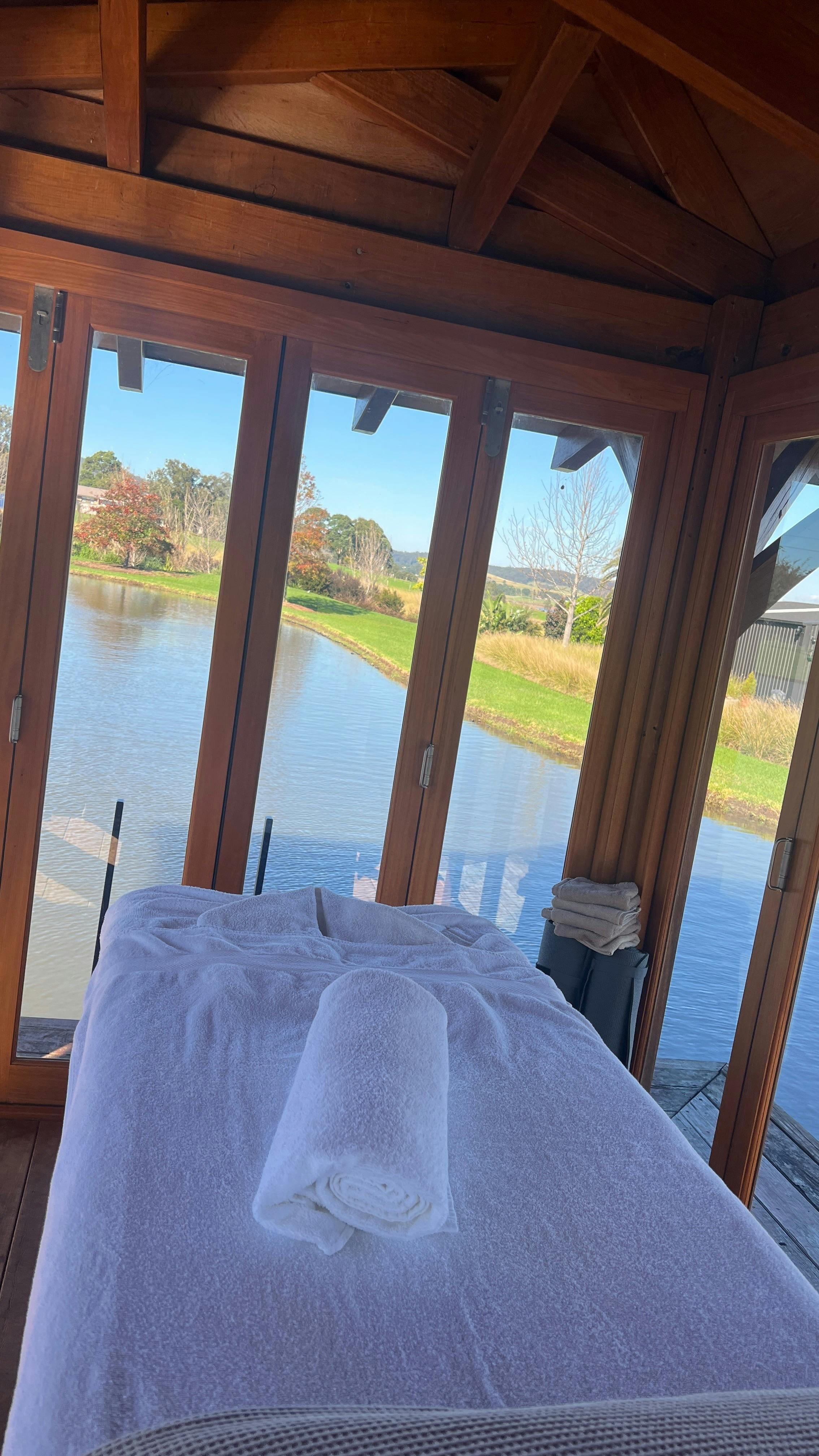 “Mobile massage setup ready to pamper guests in a luxury South Coast home with stunning views.