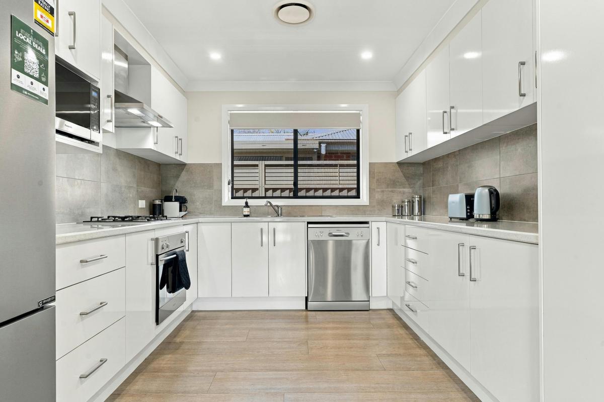 Modern white kitchen at Morrisset Retreat