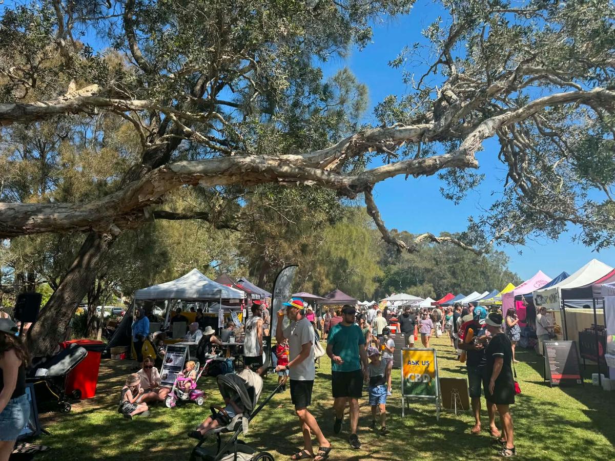 Visitors enjoying local shopping, food and sunshine at Long Jetty Markets.