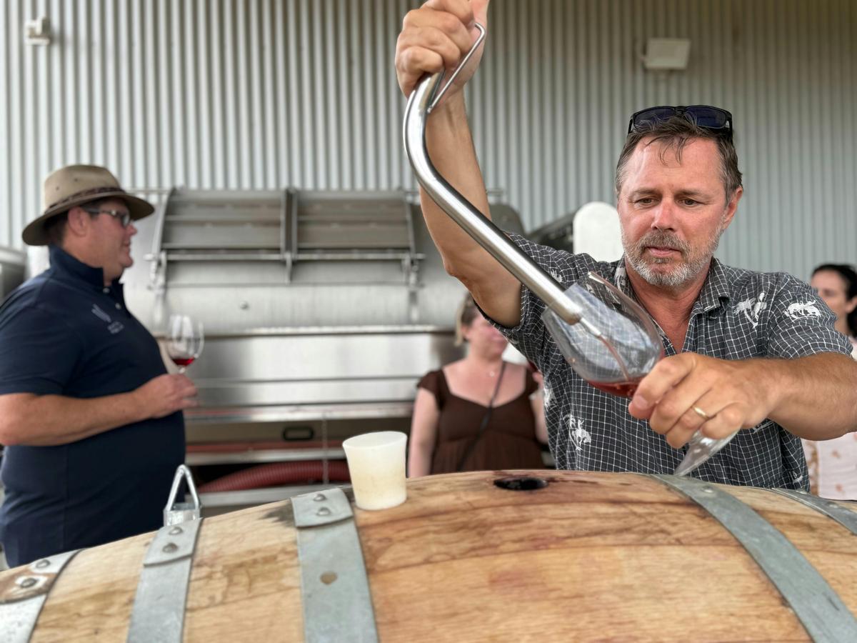 A behind-the-scenes barrel tasting during the Growing to Glass experience.