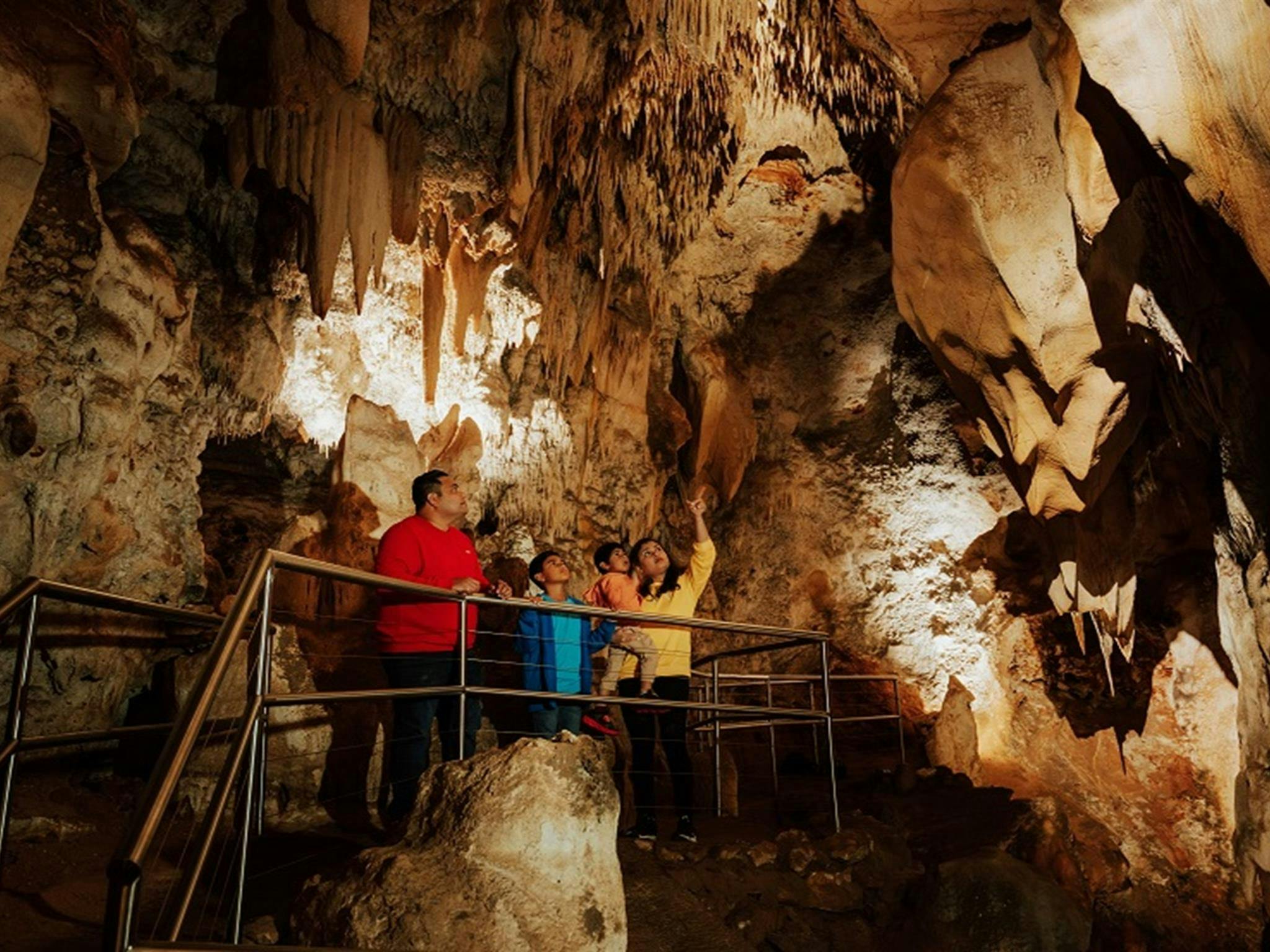 Visitors check out impressive cave formations in Wollondilly Cave. Credit: Remy Brand/DPE &copy;