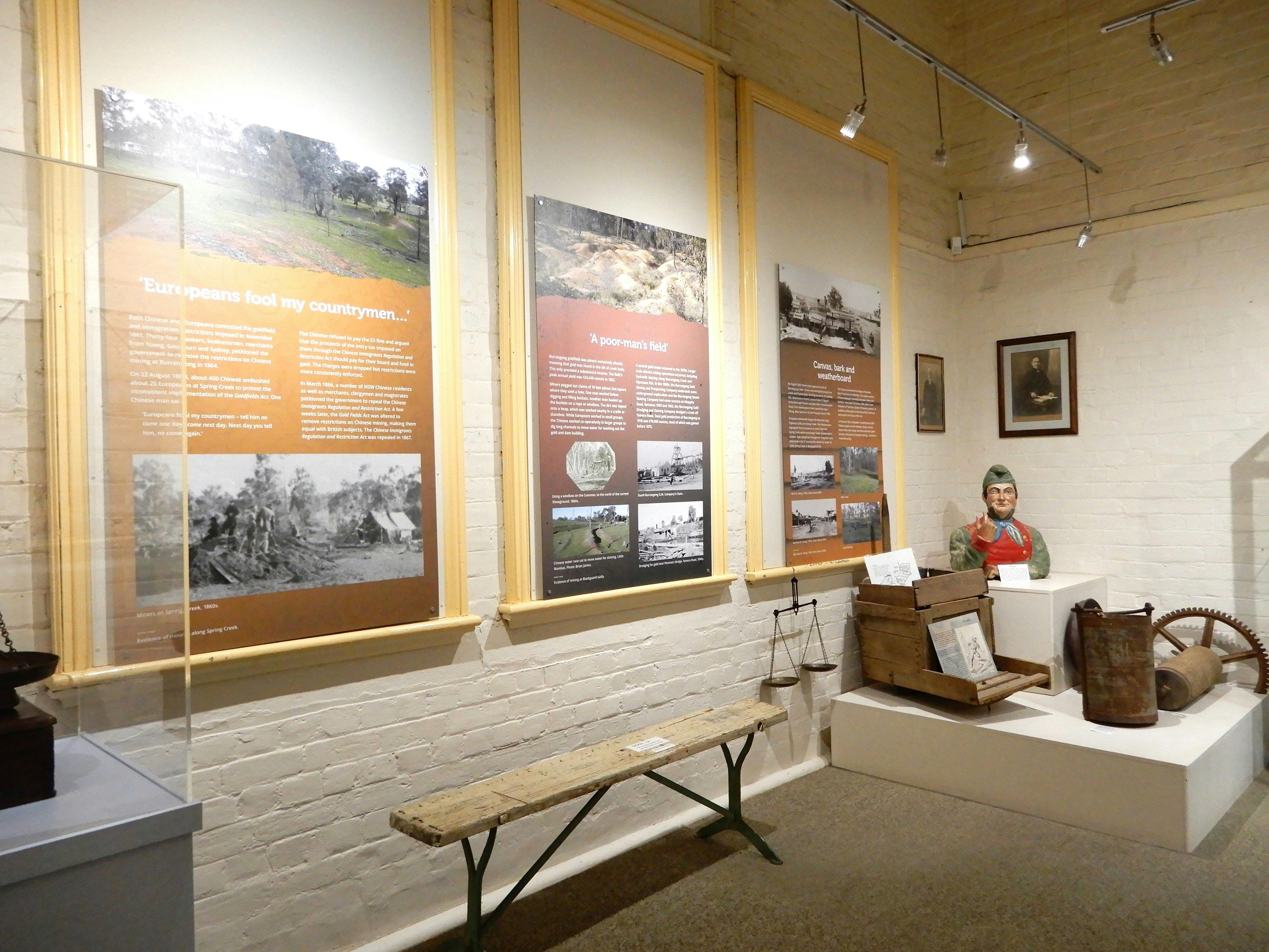 Reading boards describing historical events. One title reads "Europeans fool my country men..."
