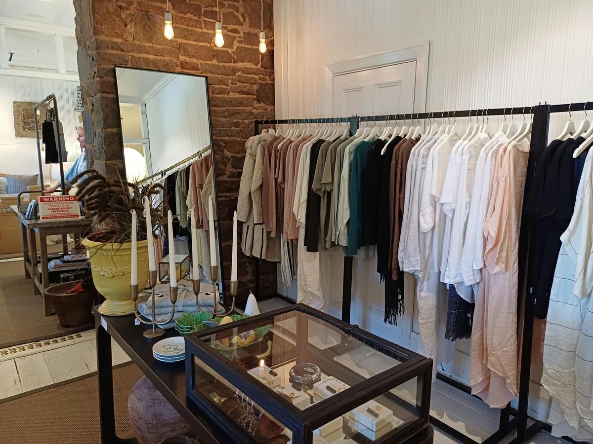 Shopping in Curators Collective, with homewares and clothing for sale.