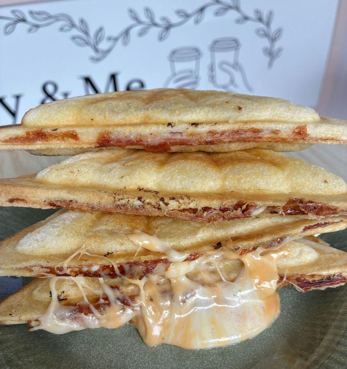 Ham and cheese toasty with cheese oozing out