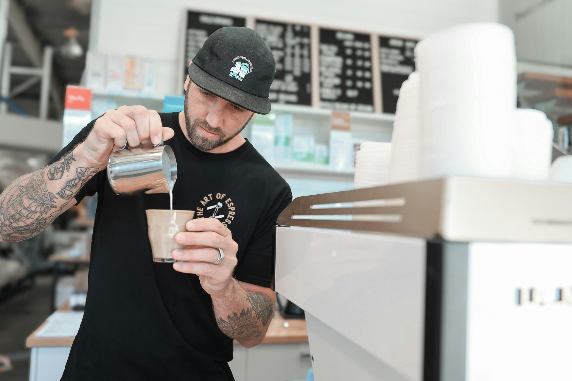 Pouring a latte in the Artisti Espresso Bar