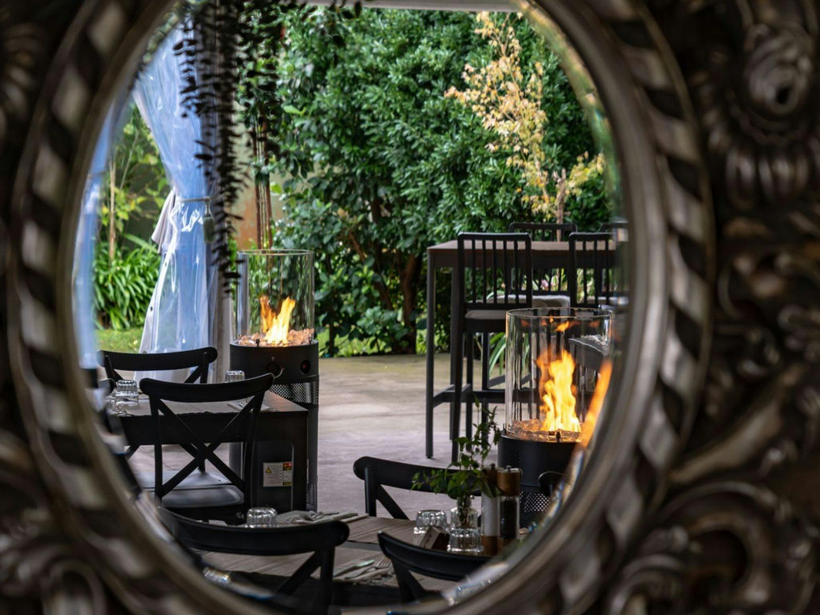 Garden dining by the fire—relax and unwind in our lush, tranquil outdoor space.