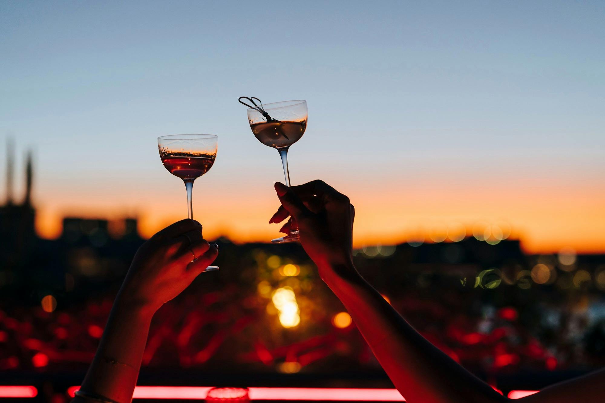 Hands holding up glasses