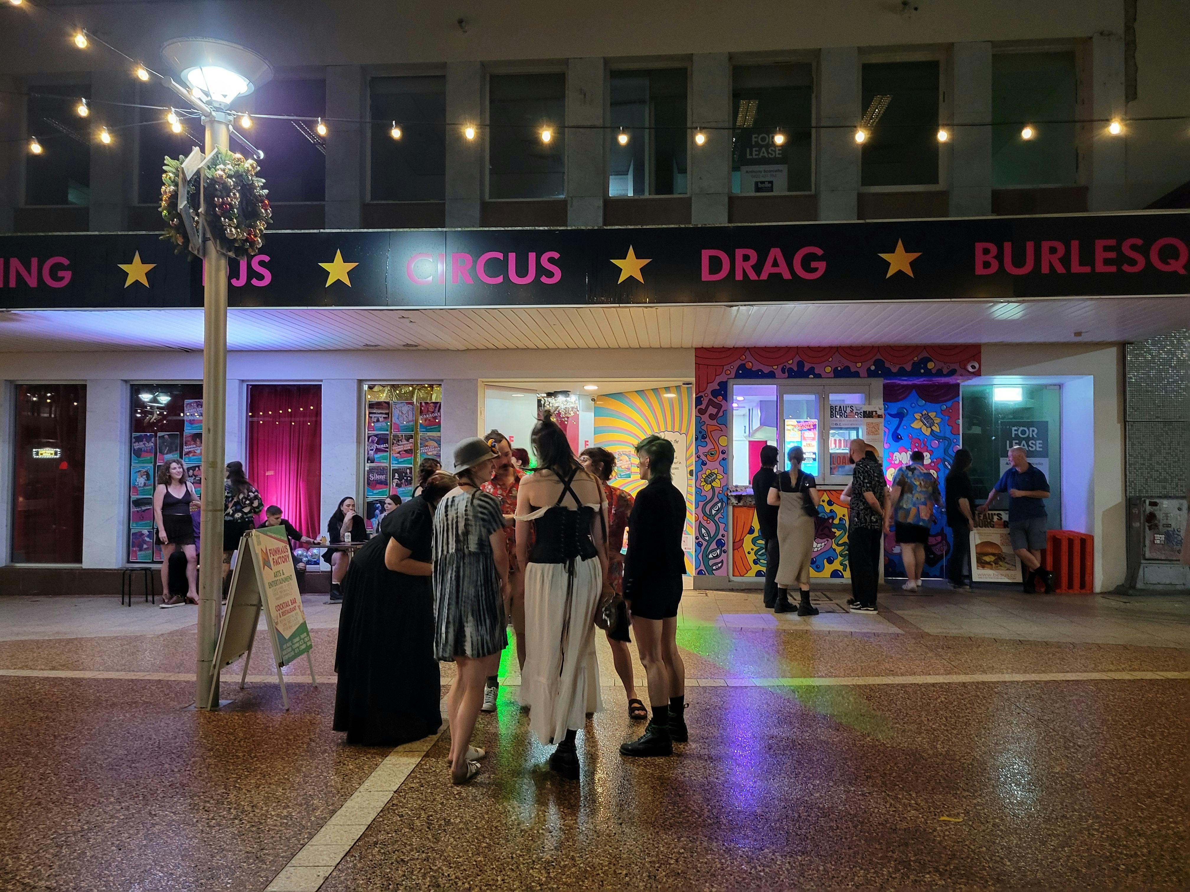 Image of people outside Beau's Burgers at night