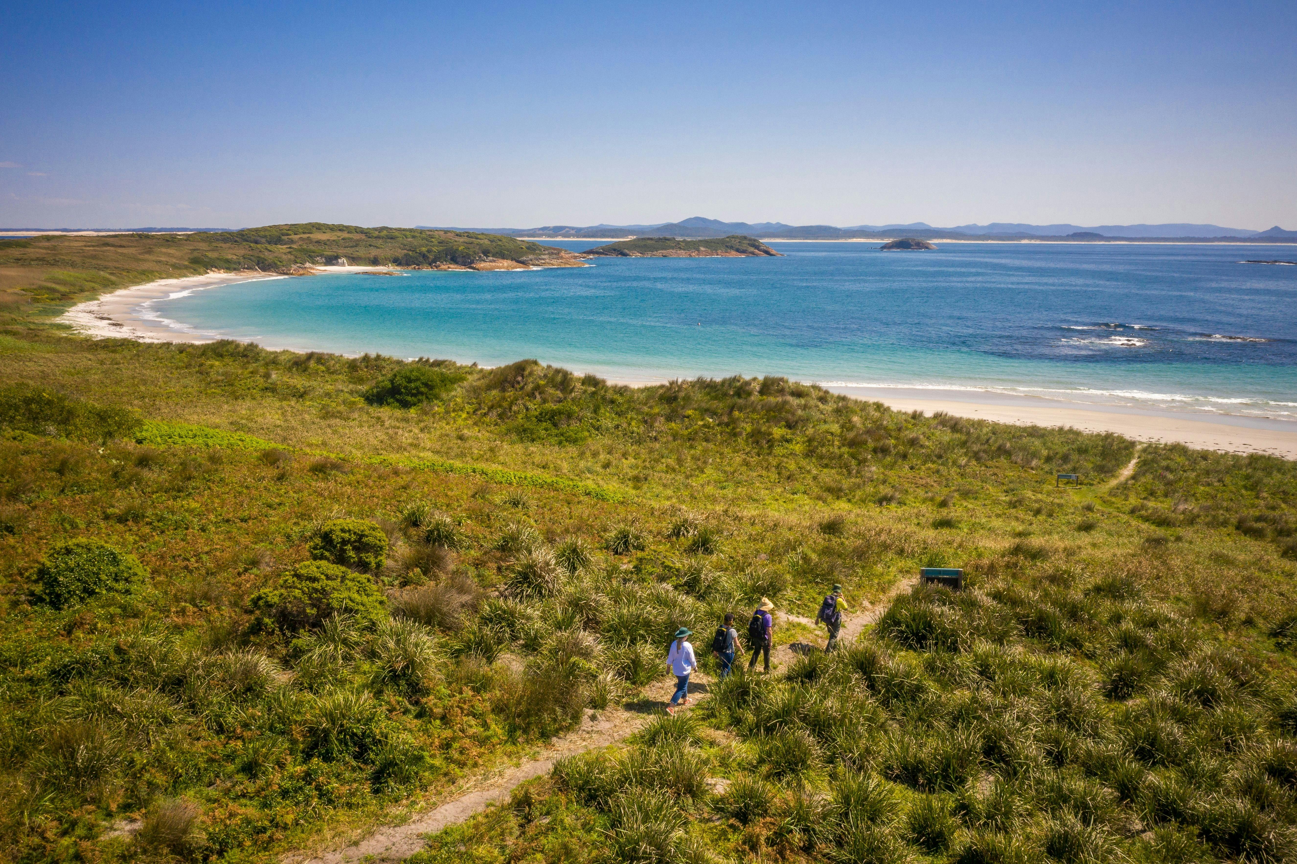 People walking along the walking track, Providence Beach, Broughton Island, Myall Lakes NationalPark