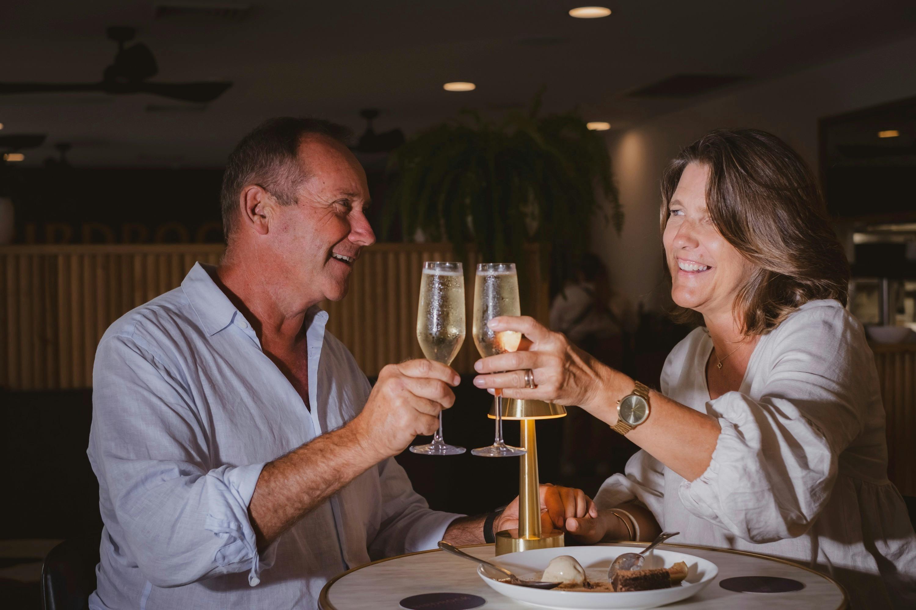 Couple drinking champagne at Birdrock Bar & Grill