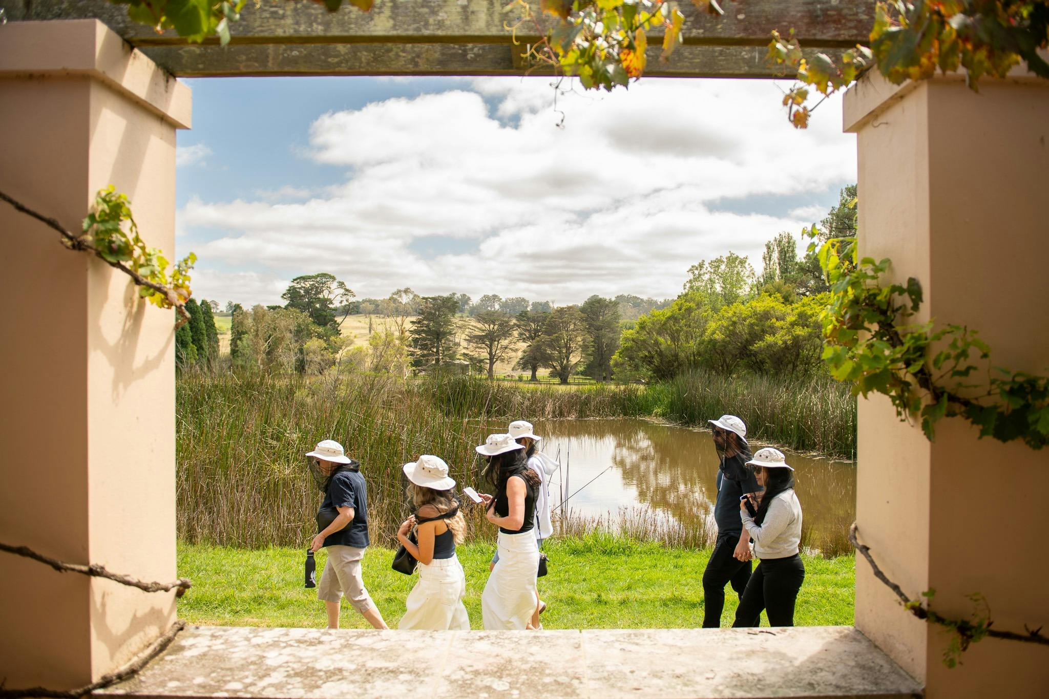 A tour group wlaking past our lake