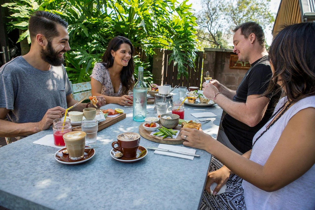 Friends enjoying a relaxed breakfast at Cafe Enzo, Pokolbin