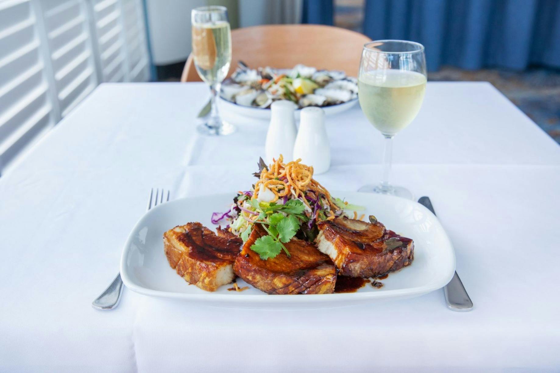 Mouthwatering meals. Pork belly and oysters. Dining for two.