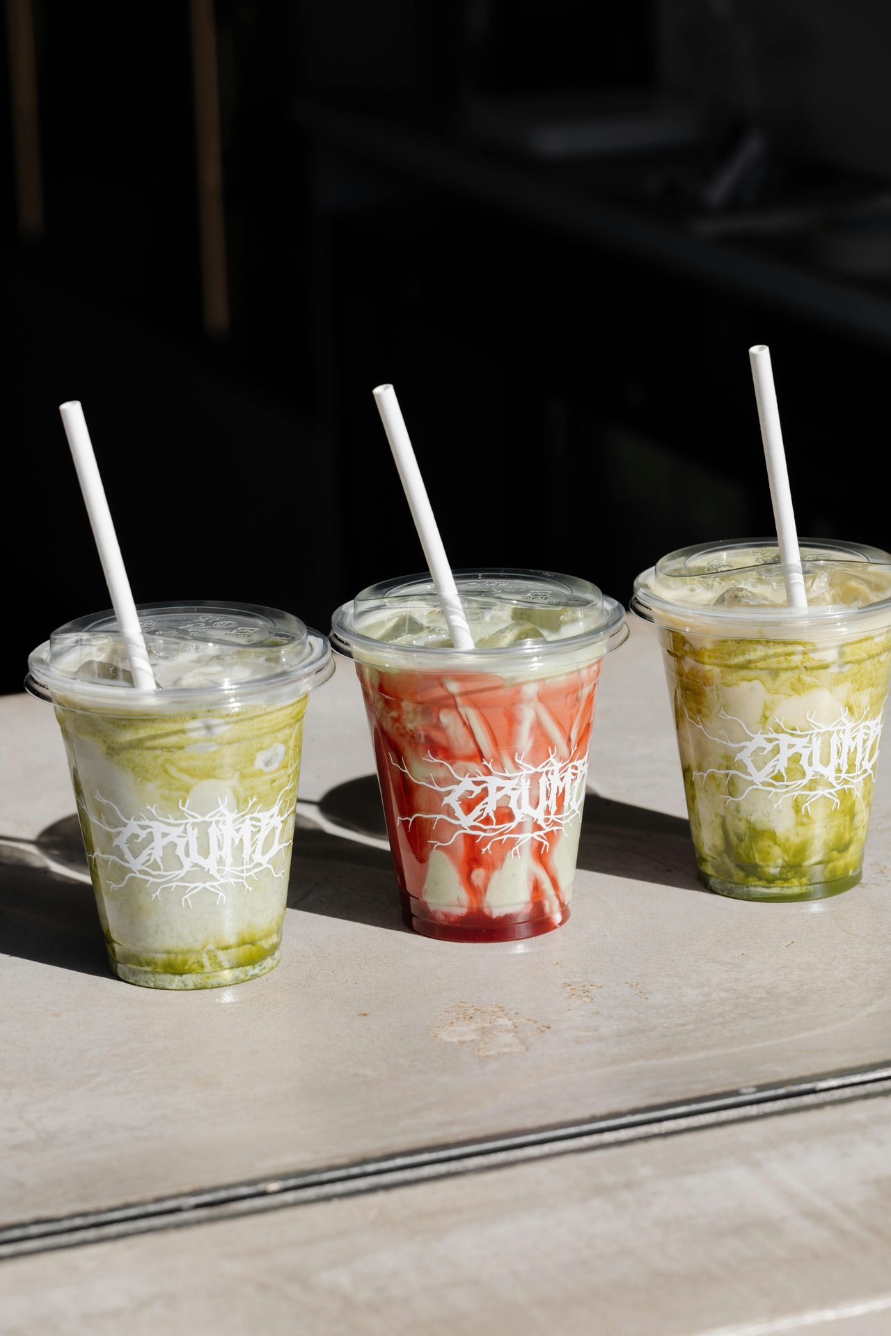 Line up of colourful drinks at Crumb