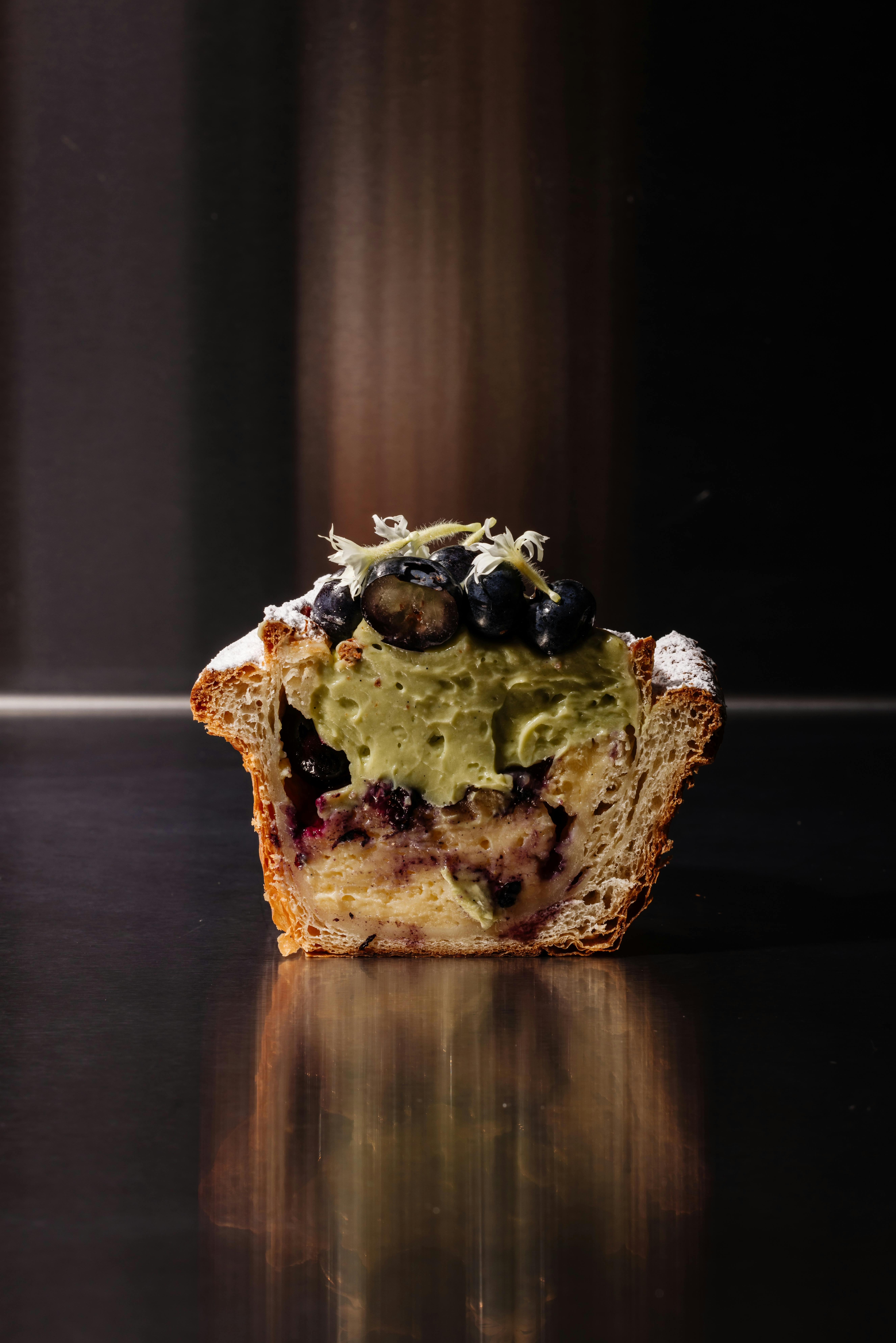 Cross-section of blueberry and custard pastry at Crumb