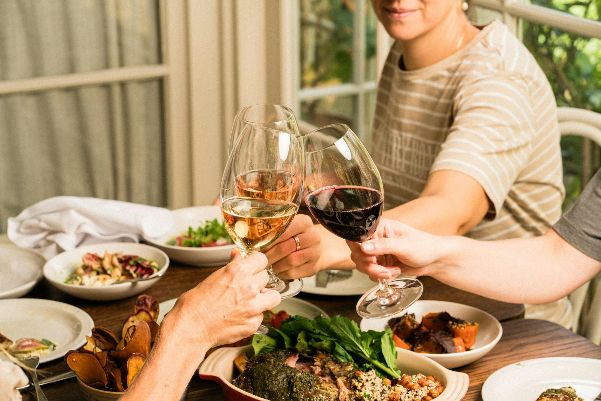 Three wine glasses cheers