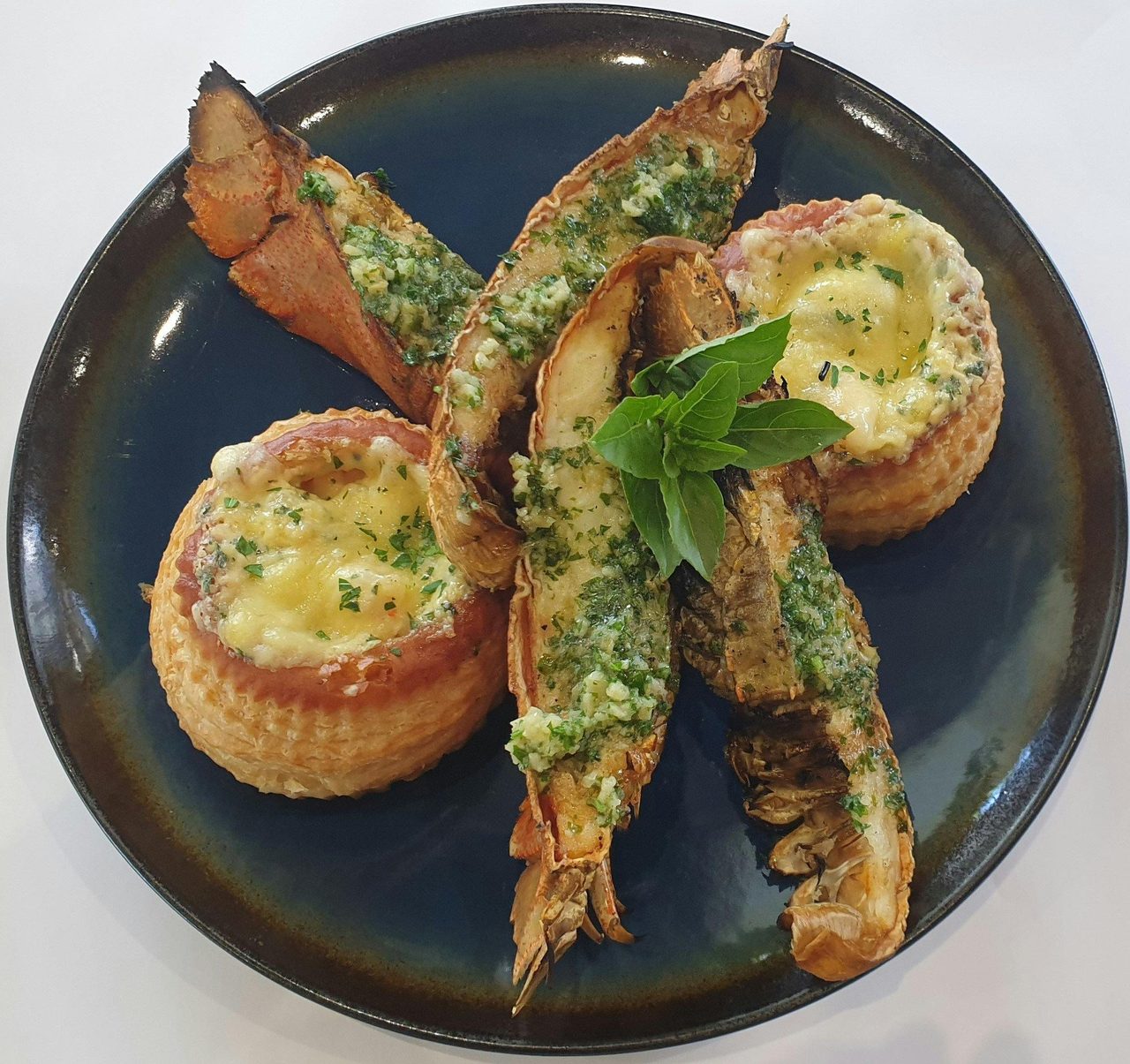 Morten Bay Bug accompanied by Garlic Chili Prawn vol au vent