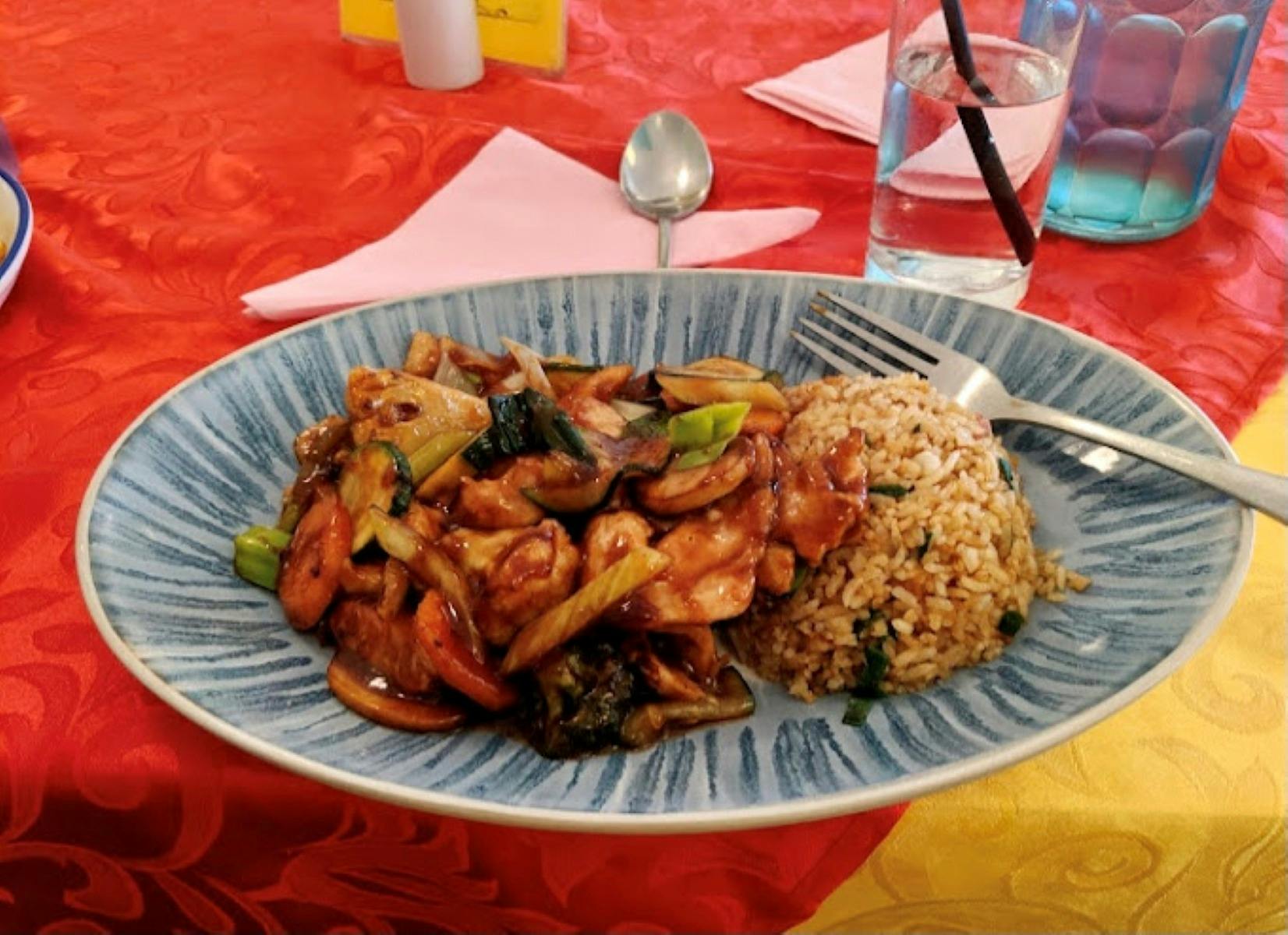 Chinese dish with fried rice on the side.