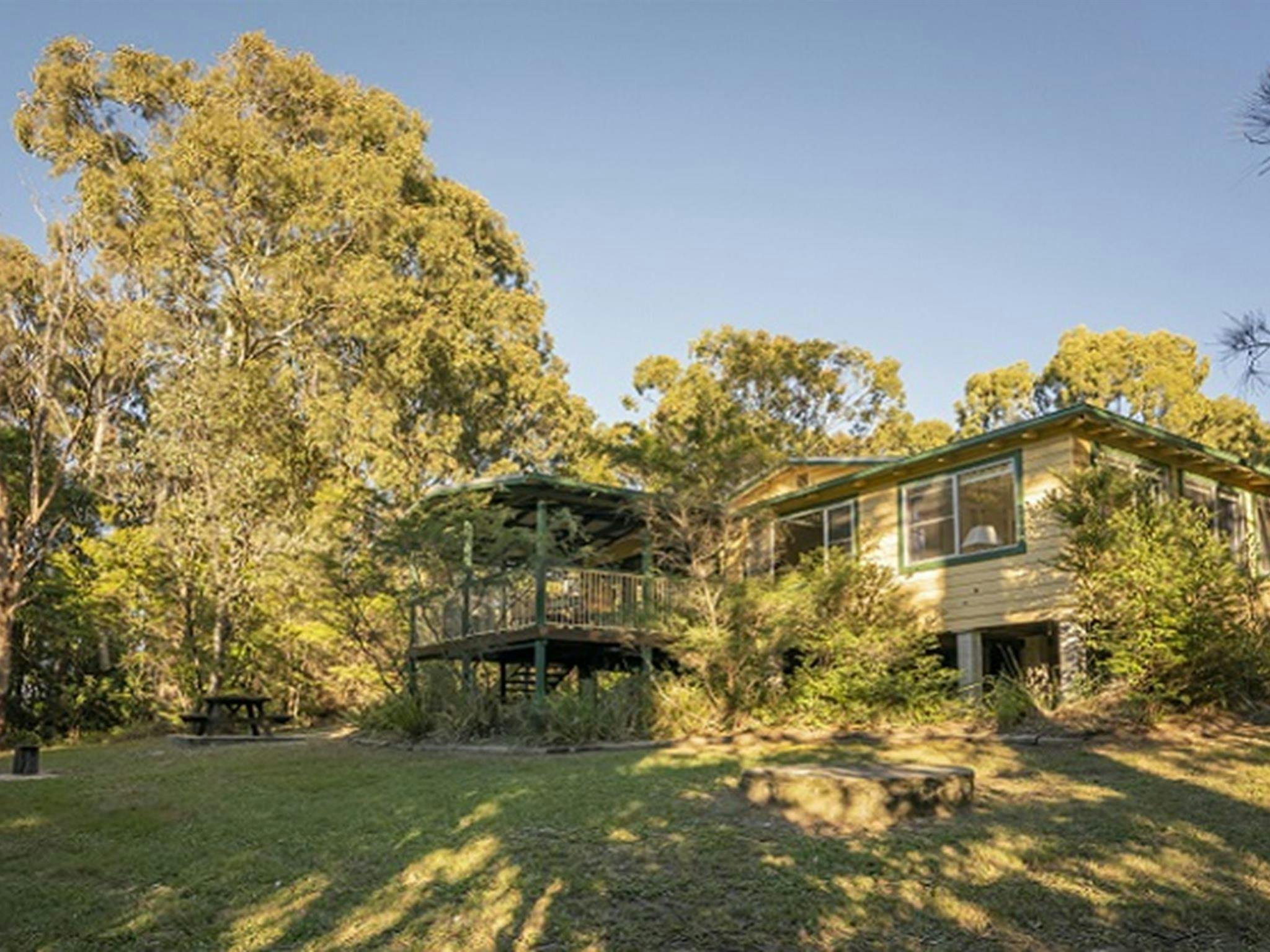 Exterior and back garden, Tuckers Rocks Cottage, Bongil Bongil National Park. Photo: John