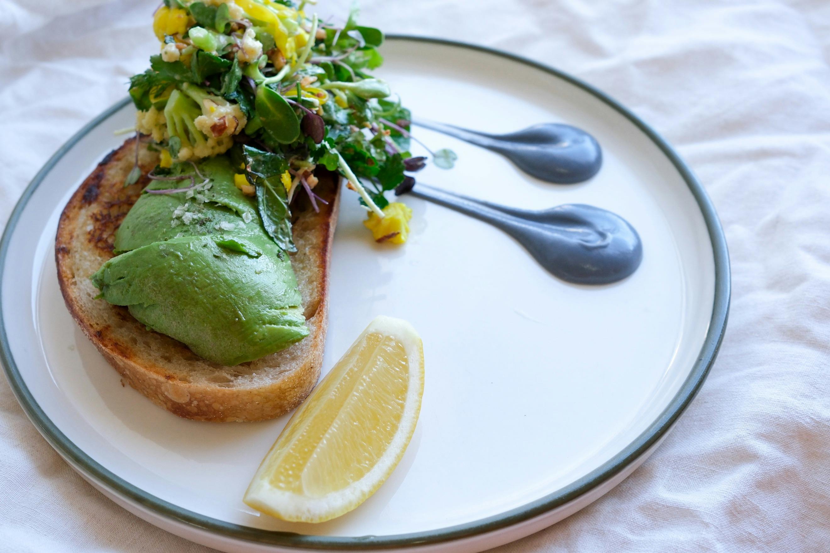 Avocado toast with pickles cauliflower and almond salad