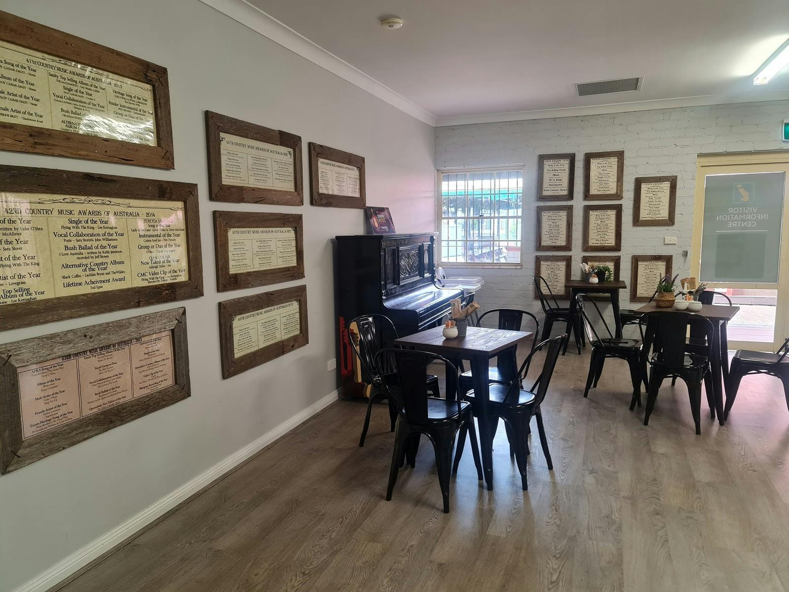 Photo of back entry to the Golden Guitar Cafe and seating options