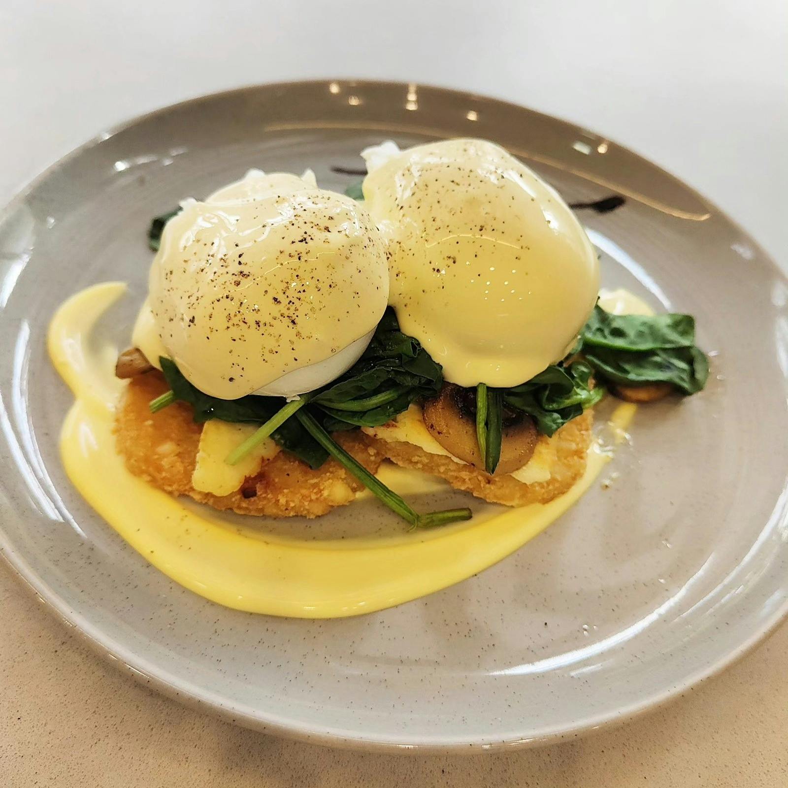 2 eggs benedict on a plate