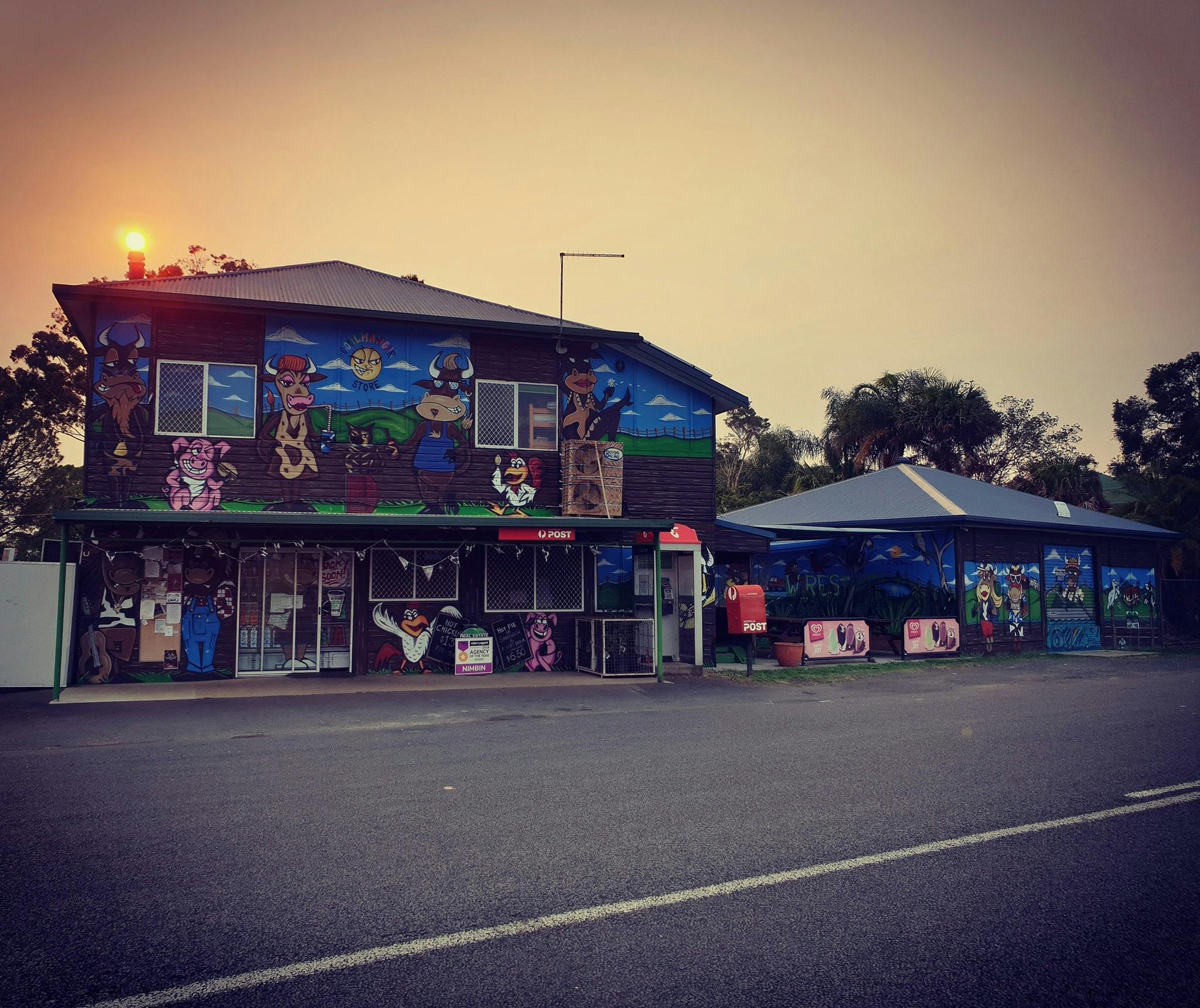 General Store front displaying beautiful cow murals