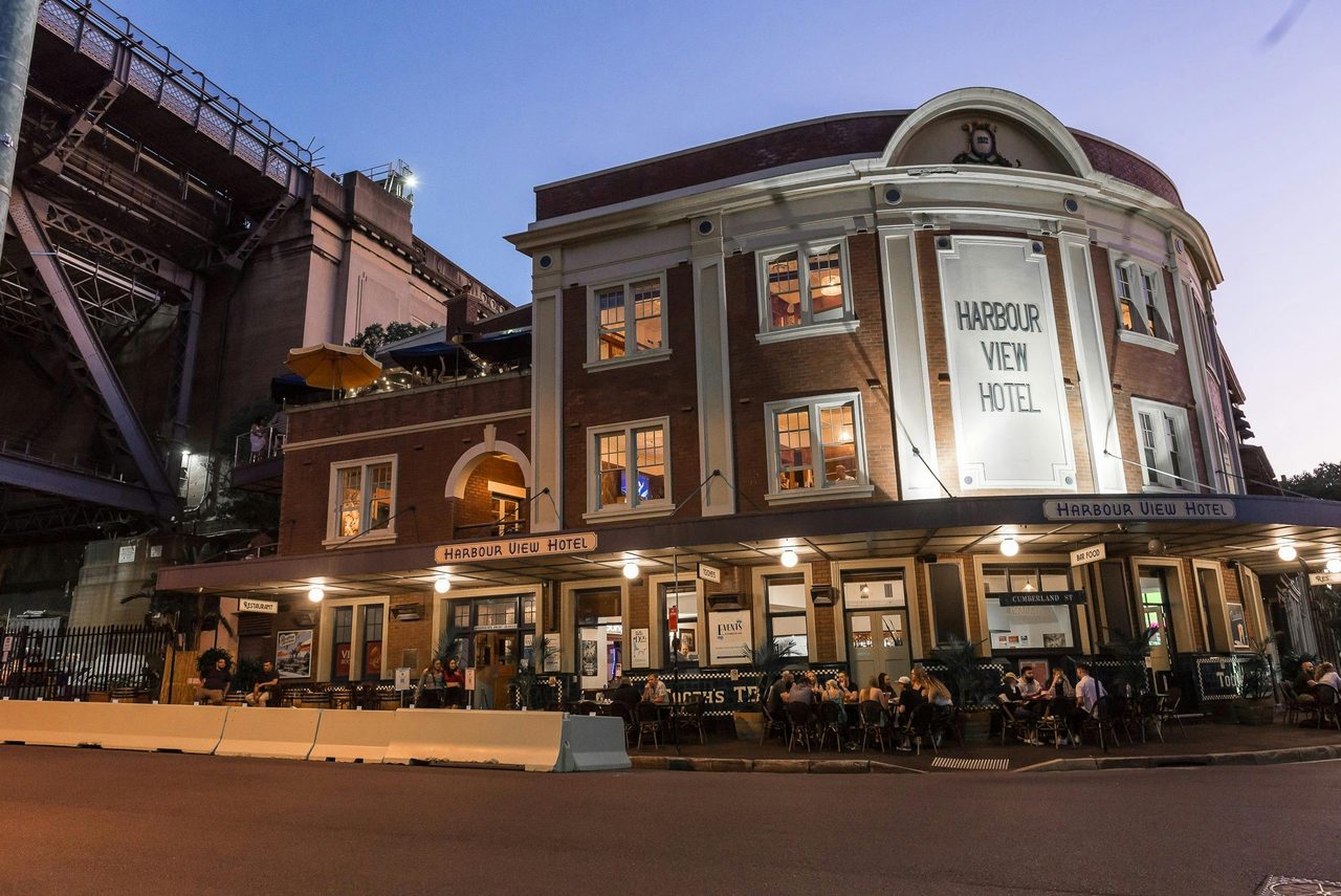 The exterior of the hotel at dusk
