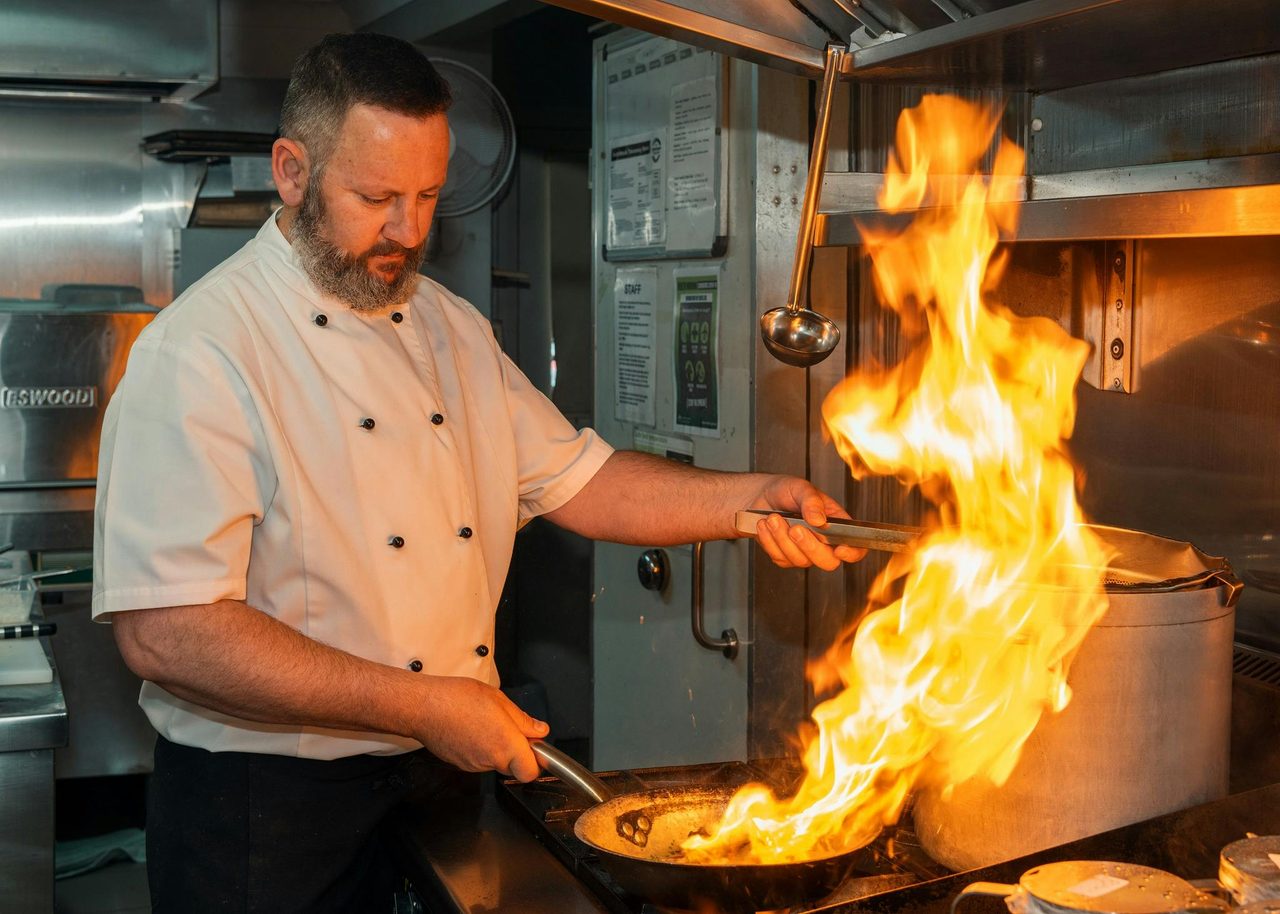 Chef Frank Flambéing at the stove