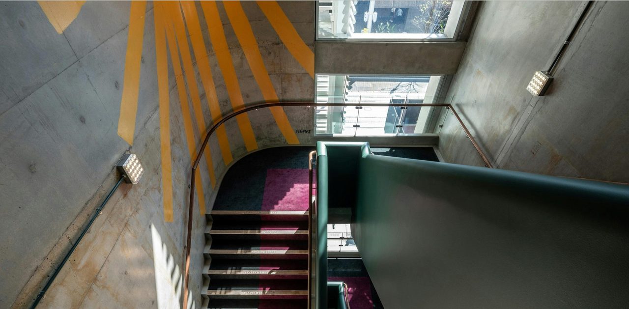 Jacksons on George stairwell with a custom mural from Australian artist Marty Baptist