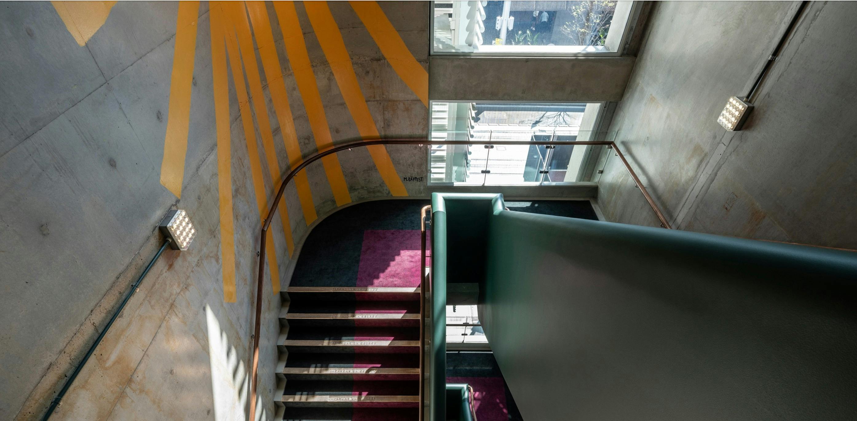 Jacksons on George stairwell with a custom mural from Australian artist Marty Baptist