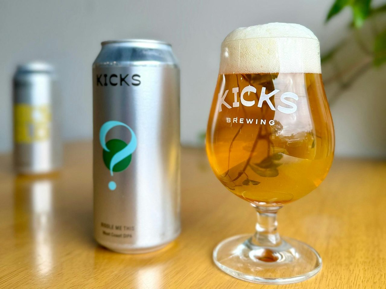 Two cans and one glass of west coast IPA brewed by Marrickville brewery Kicks Brewing