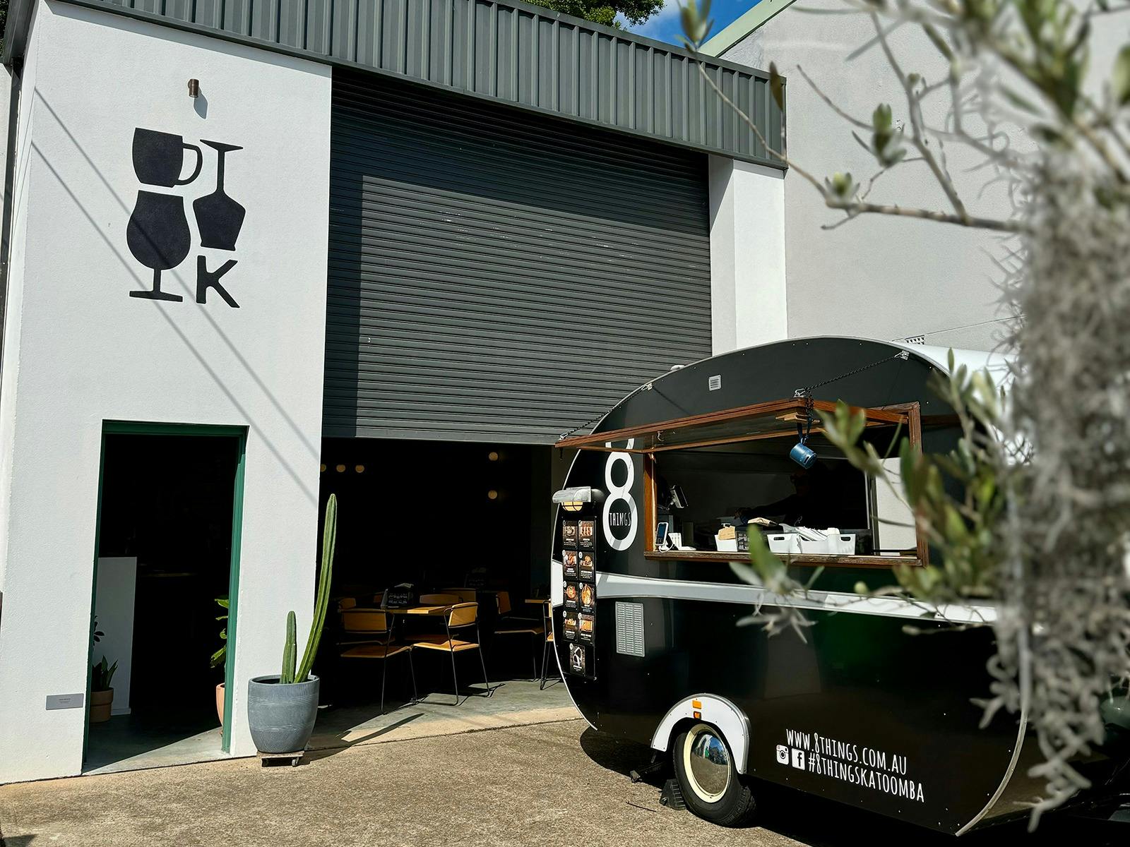 A food truck parked outside Kicks Brewing's taproom