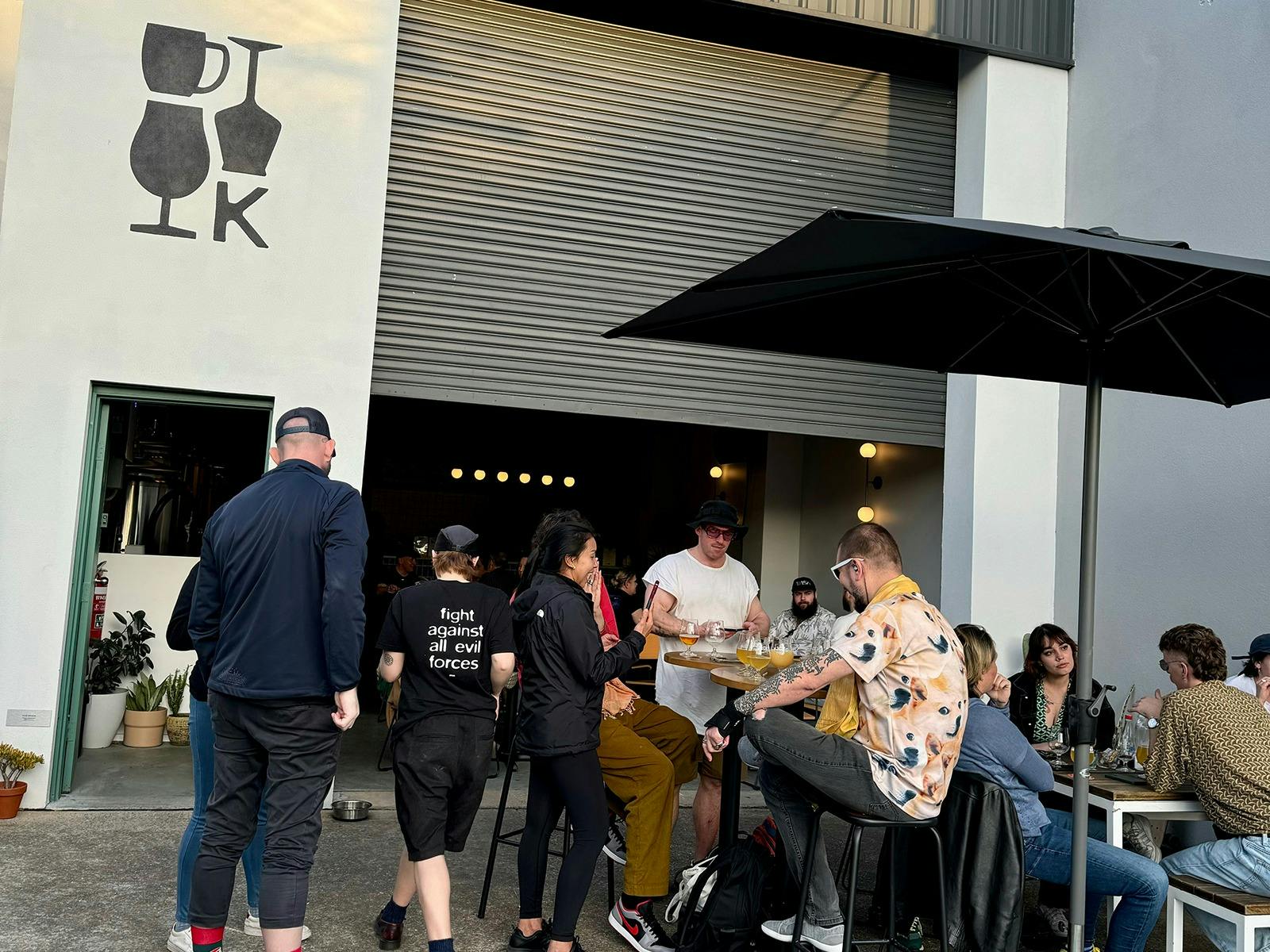 Kicks Brewing outdoor courtyard filled with people enjoying a beer