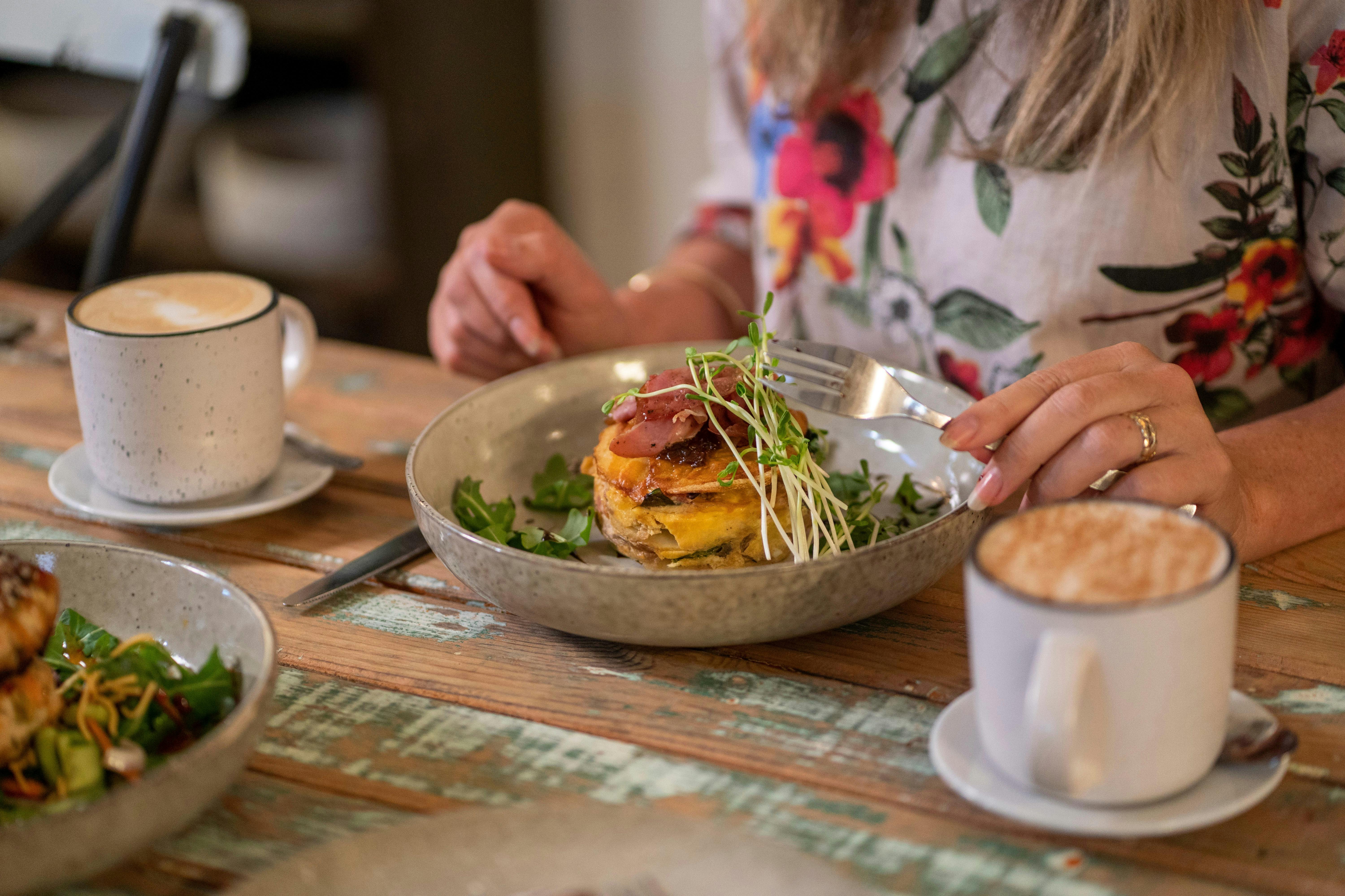 Woman eating a meal at Red Door Cafe