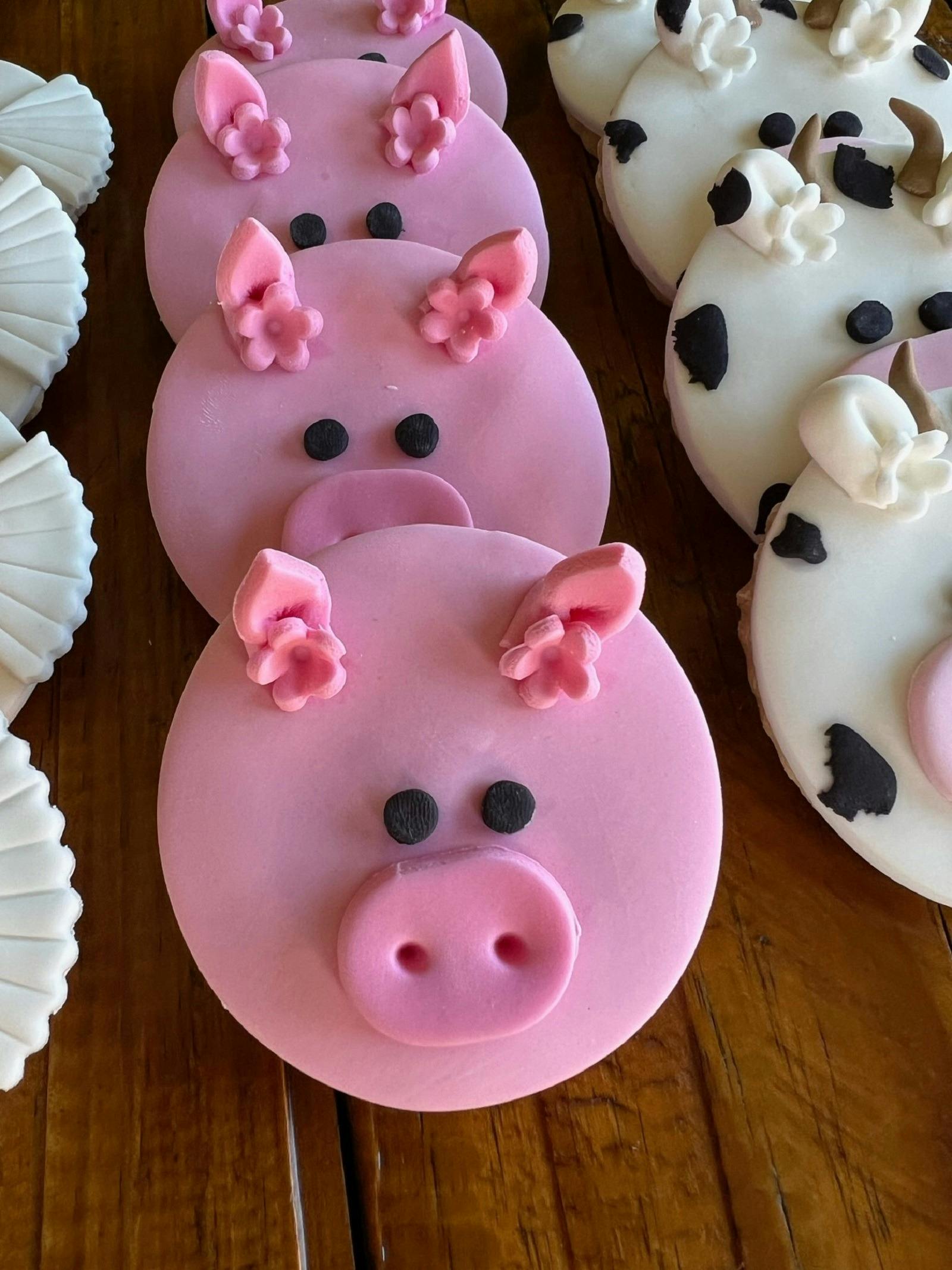 Pink pig faced cookies.