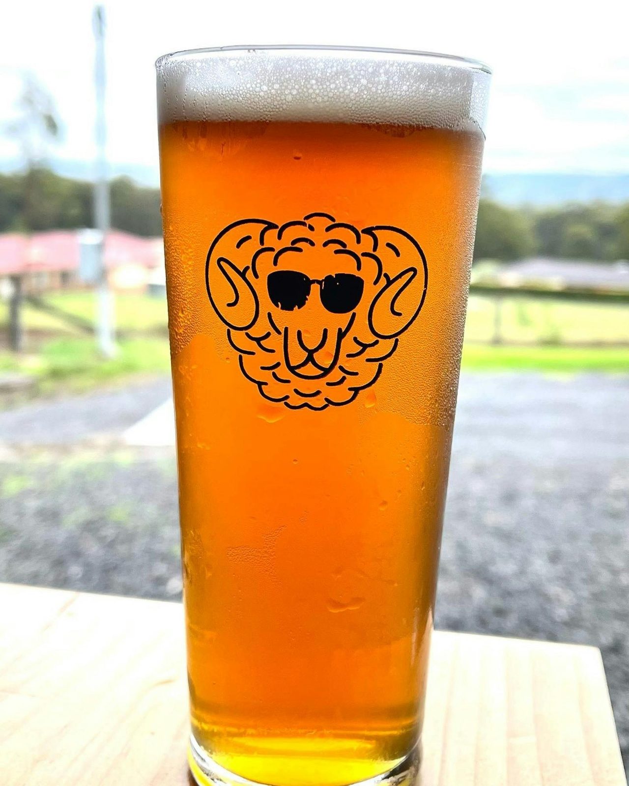 Glassof beer with sheep emblem