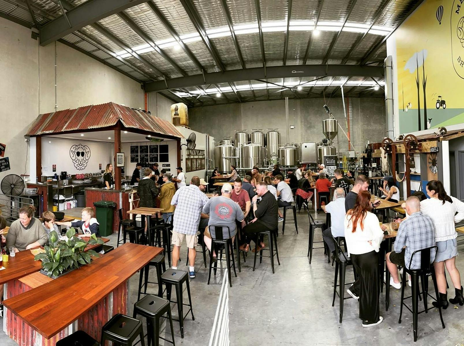 warehouse with bar, people and distillary