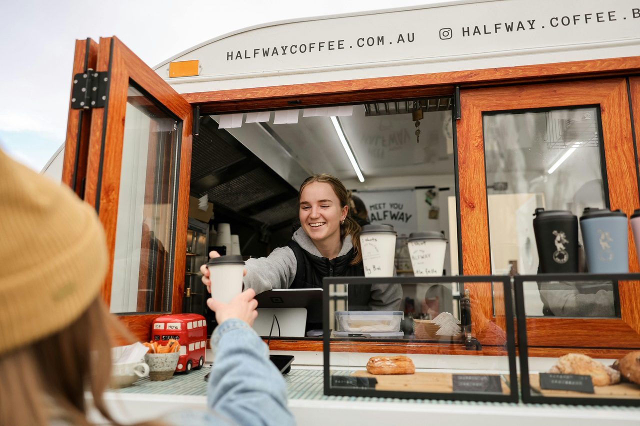 Brooke passing out a coffee