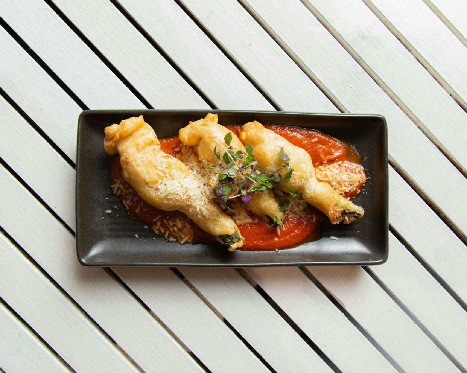 Plate of fried zucchini with sauce