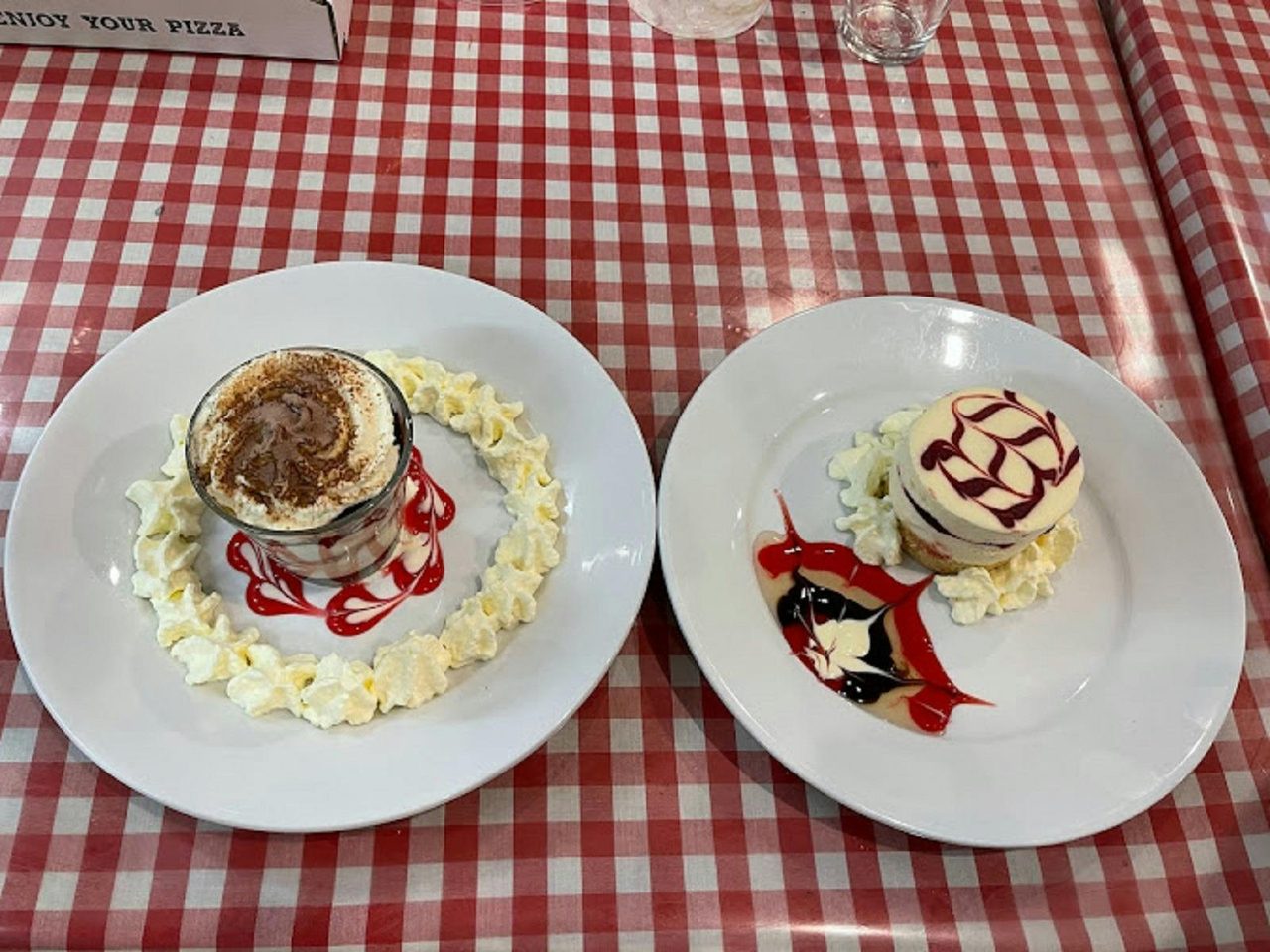 Two plates full of sweets and coffee