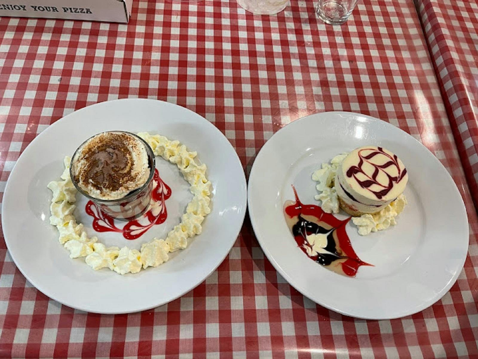 Two plates full of sweets and coffee