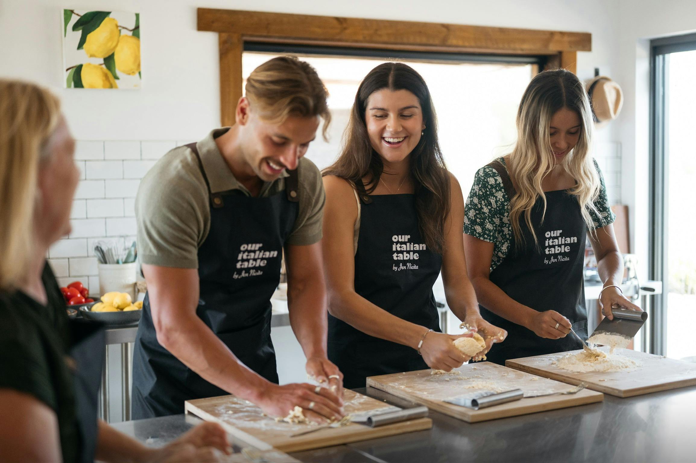 Laughing while rolling pasta