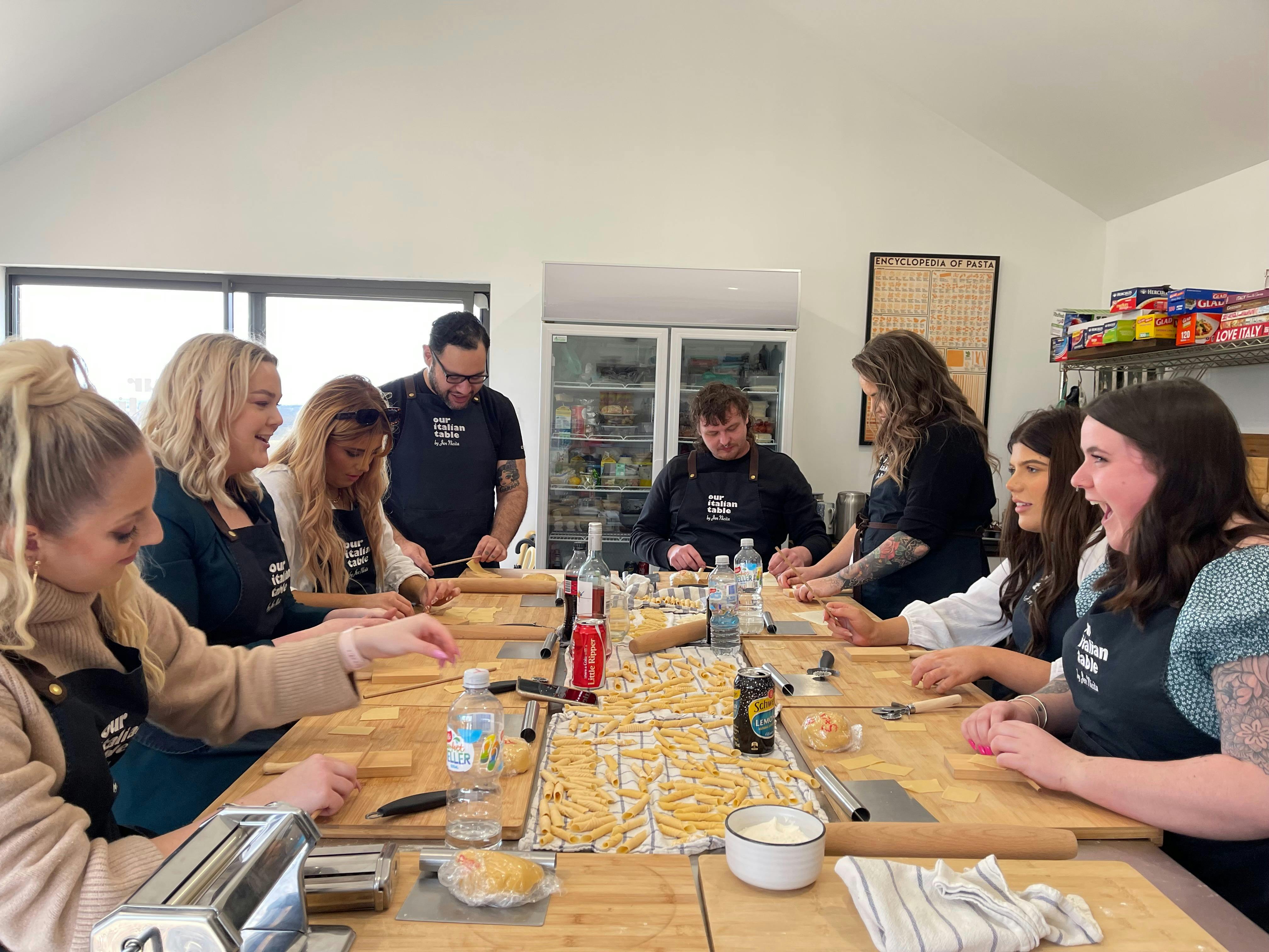 Having fun making pasta in the school