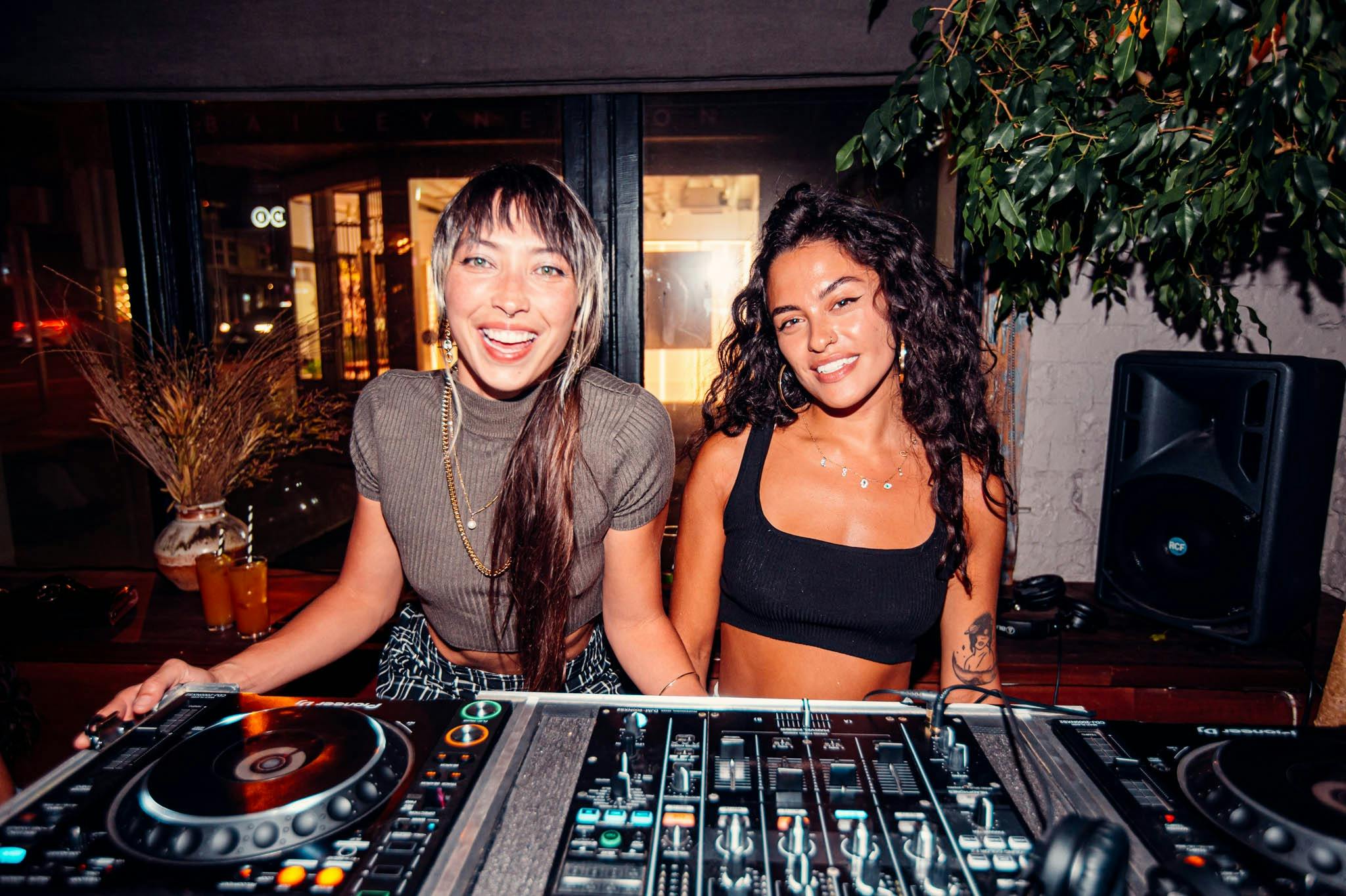 Two DJ's behind the decks