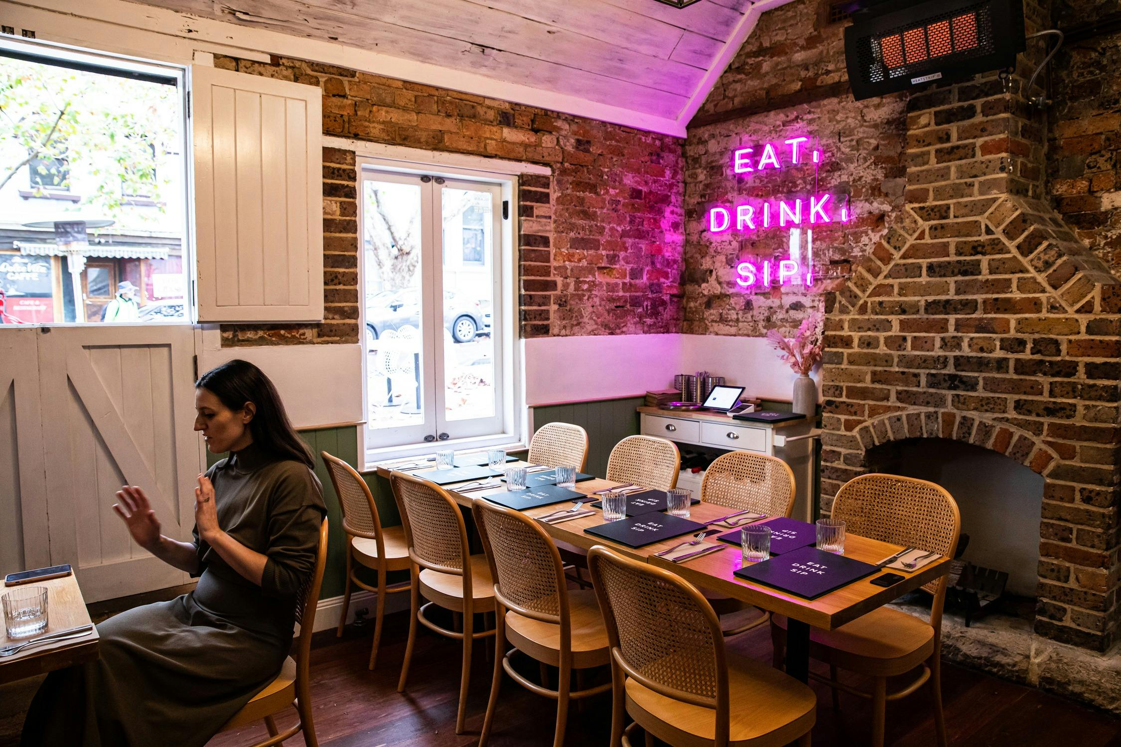 Cosy indoor dining area within sandstone cottage