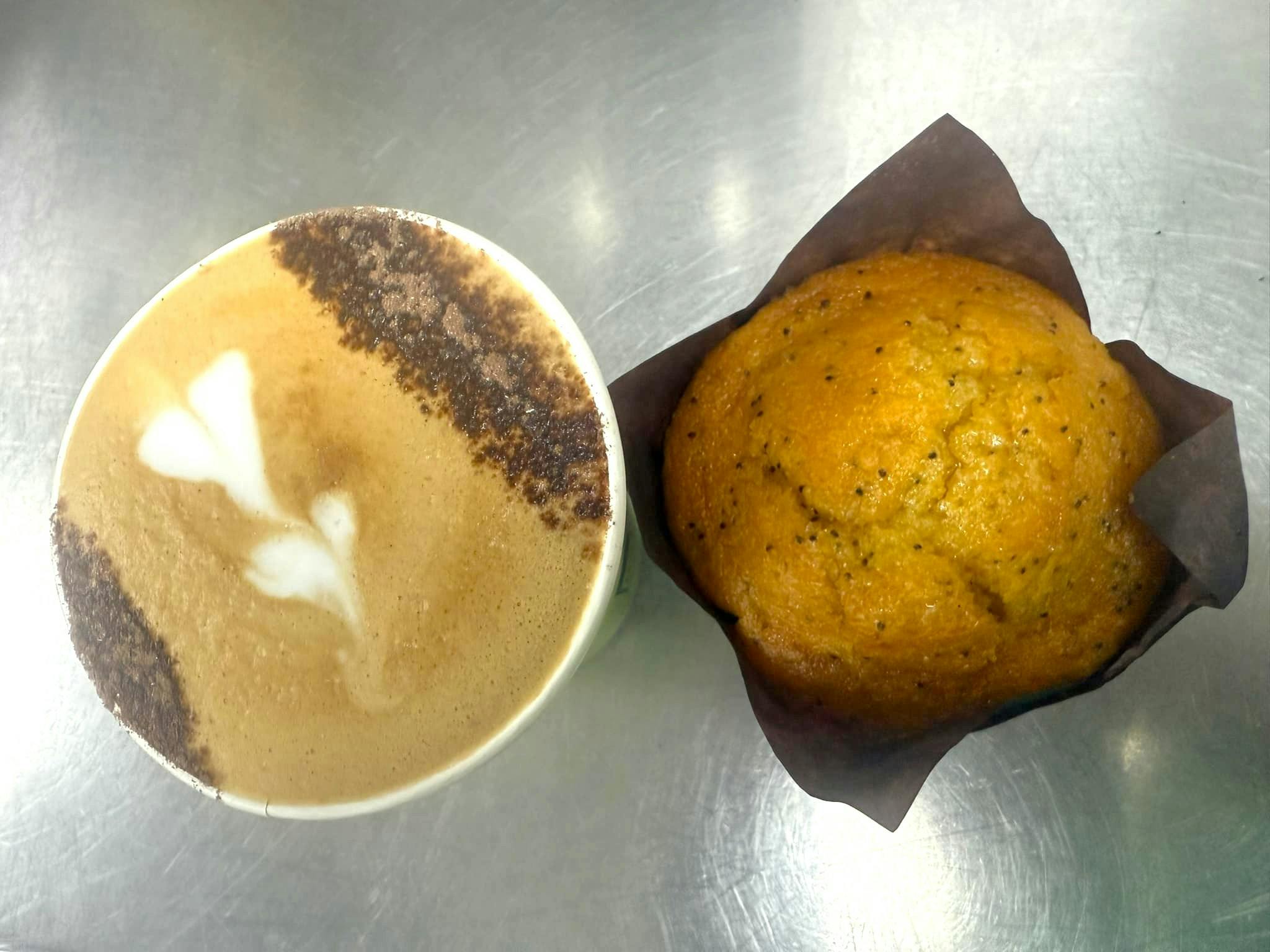 Cup of coffee and a poppy seed muffin.